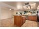 Kitchen boasts granite countertops, an island with seating, and stainless steel appliances at 2705 W Summit Pl, Chandler, AZ 85224