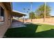 Relaxing backyard with a refreshing pool and grassy area at 2705 W Summit Pl, Chandler, AZ 85224