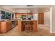Eat-in kitchen with wood cabinets, center island and granite countertops at 2705 W Summit Pl, Chandler, AZ 85224