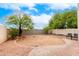 Landscaped backyard with a paved patio and space for outdoor furniture at 1515 E South Fork Dr, Phoenix, AZ 85048
