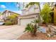 Two-story house with attached garage and landscaping at 1515 E South Fork Dr, Phoenix, AZ 85048