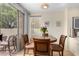 Charming dining area with a table for four and access to a patio at 1515 E South Fork Dr, Phoenix, AZ 85048