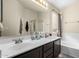 Bathroom with double sinks, shower, and bathtub at 1515 E South Fork Dr, Phoenix, AZ 85048