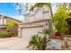 Two-story house with attached garage and landscaping at 1515 E South Fork Dr, Phoenix, AZ 85048