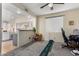 Home office space with a view of the kitchen and a putting green at 1515 E South Fork Dr, Phoenix, AZ 85048