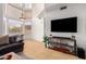 Bright living room with vaulted ceilings and a large flat-screen TV at 1515 E South Fork Dr, Phoenix, AZ 85048