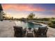 Resort-style pool with expansive patio and seating area, perfect for outdoor entertaining at 10422 E Mark Ln, Scottsdale, AZ 85262