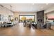 Open floor plan great room with fireplace, dining area, and scenic views at 10422 E Mark Ln, Scottsdale, AZ 85262