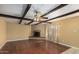 Living room features hardwood floors, a brick fireplace, and wood beam ceilings at 5850 W Cheery Lynn Rd, Phoenix, AZ 85031