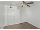 Bedroom with wood-look flooring, closet, and ceiling fan at 5850 W Cheery Lynn Rd, Phoenix, AZ 85031