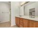 Bathroom boasts a double vanity and a walk-in shower at 12948 W El Sueno Ct, Sun City West, AZ 85375