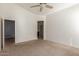 Bright bedroom with carpeted floors and access to bathroom at 727 W Judi Dr, Casa Grande, AZ 85122
