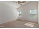 Spacious bedroom with neutral carpeting and ceiling fan at 727 W Judi Dr, Casa Grande, AZ 85122