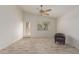 Spacious living room with wood-look tile floors and a ceiling fan at 727 W Judi Dr, Casa Grande, AZ 85122
