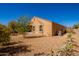 View of home's exterior and backyard with desert landscape at 727 W Judi Dr, Casa Grande, AZ 85122
