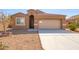 One-story home with a two-car garage and desert landscaping at 727 W Judi Dr, Casa Grande, AZ 85122