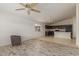 Open concept kitchen and living area with granite countertops and dark wood cabinets at 727 W Judi Dr, Casa Grande, AZ 85122