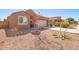 One-story home with a desert front yard, featuring a two-car garage at 727 W Judi Dr, Casa Grande, AZ 85122