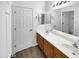 Double vanity bathroom with wood cabinets and mirror at 11575 W Buchanan St, Avondale, AZ 85323