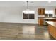 Bright dining area with hardwood floors and kitchen views at 11575 W Buchanan St, Avondale, AZ 85323