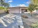 Single story home with two car garage and desert landscaping at 11575 W Buchanan St, Avondale, AZ 85323