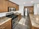 Modern kitchen features stainless steel appliances and ample cabinetry at 11575 W Buchanan St, Avondale, AZ 85323