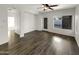 Light-filled living room, hardwood floors, and backyard access at 11575 W Buchanan St, Avondale, AZ 85323