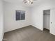 Bright bedroom with neutral carpeting and closet at 11575 W Buchanan St, Avondale, AZ 85323