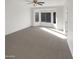 Spacious bedroom with carpeted floors and large windows at 11575 W Buchanan St, Avondale, AZ 85323