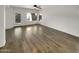 Open living room with hardwood floors and patio access at 11575 W Buchanan St, Avondale, AZ 85323