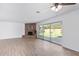 Living area with brick fireplace and sliding glass doors to backyard at 1350 E Pepper Pl, Mesa, AZ 85203