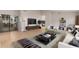 Living room with comfy seating and large TV at 2114 S El Marino --, Mesa, AZ 85202