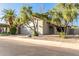 Light-grey house with a two-car garage and mature trees at 2114 S El Marino --, Mesa, AZ 85202