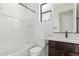Bathroom with a bathtub, toilet and dark wood vanity at 16173 S 181St Ave, Goodyear, AZ 85338
