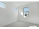 Bright bedroom with grey carpet and multiple windows at 16173 S 181St Ave, Goodyear, AZ 85338