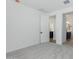 Spacious bedroom with grey carpet and door to bathroom and kitchen at 16173 S 181St Ave, Goodyear, AZ 85338