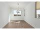 Dining room with chandelier and wood-look tile floors at 16173 S 181St Ave, Goodyear, AZ 85338