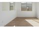 Spacious dining area with large windows and wood-look tile floors at 16173 S 181St Ave, Goodyear, AZ 85338