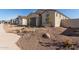 Single story house with two car garage and desert landscaping at 16173 S 181St Ave, Goodyear, AZ 85338