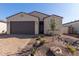 Single story house with two car garage and desert landscaping at 16173 S 181St Ave, Goodyear, AZ 85338