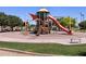 Community playground with slide, shade, and green areas at 2684 E San Miguel Dr, Casa Grande, AZ 85194