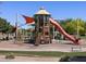 Community playground with slides, climbing structures, and shade at 2688 E San Miguel Dr, Casa Grande, AZ 85194