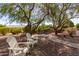 Relaxing backyard with stone patio and seating at 15741 W Piccadilly Rd, Goodyear, AZ 85395