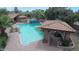 Stunning pool area with a large pool, spa, and outdoor entertaining space at 6723 E Lincoln Dr, Paradise Valley, AZ 85253