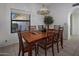 Charming dining room with wood table and six chairs at 9856 W Rimrock Dr, Peoria, AZ 85382