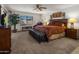 Spacious main bedroom with large bed and patio access at 9856 W Rimrock Dr, Peoria, AZ 85382