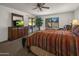 Main bedroom with dresser, large bed, and sliding door access at 9856 W Rimrock Dr, Peoria, AZ 85382