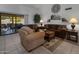 Bright living room with comfy furniture and patio access at 9856 W Rimrock Dr, Peoria, AZ 85382