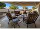 Relaxing patio furniture under covered patio at 9856 W Rimrock Dr, Peoria, AZ 85382
