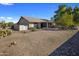 Backyard view of charming single story home with gravel landscaping at 9856 W Rimrock Dr, Peoria, AZ 85382